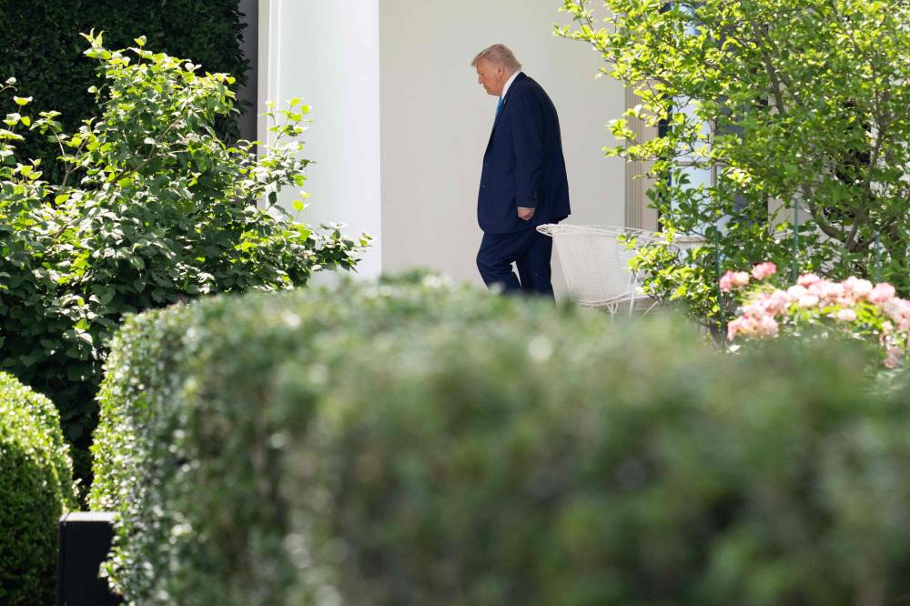 US President Donald Trum exits the Oval Office as he walks to Marine One on the South Lawn upon departure from the White House in Washington, DC, on June 6, 2025, en route to New Jersey for the weekend. US President Donald Trump said Friday that Elon Musk had 