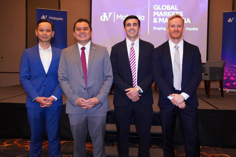 Mohamad Nizar (second from left) with the panel and host of 'Global Markets & Malaysia: Shaping the Next Six Months' at Equatorial (EQ) Plaza, Kuala Lumpur on Wednesday.