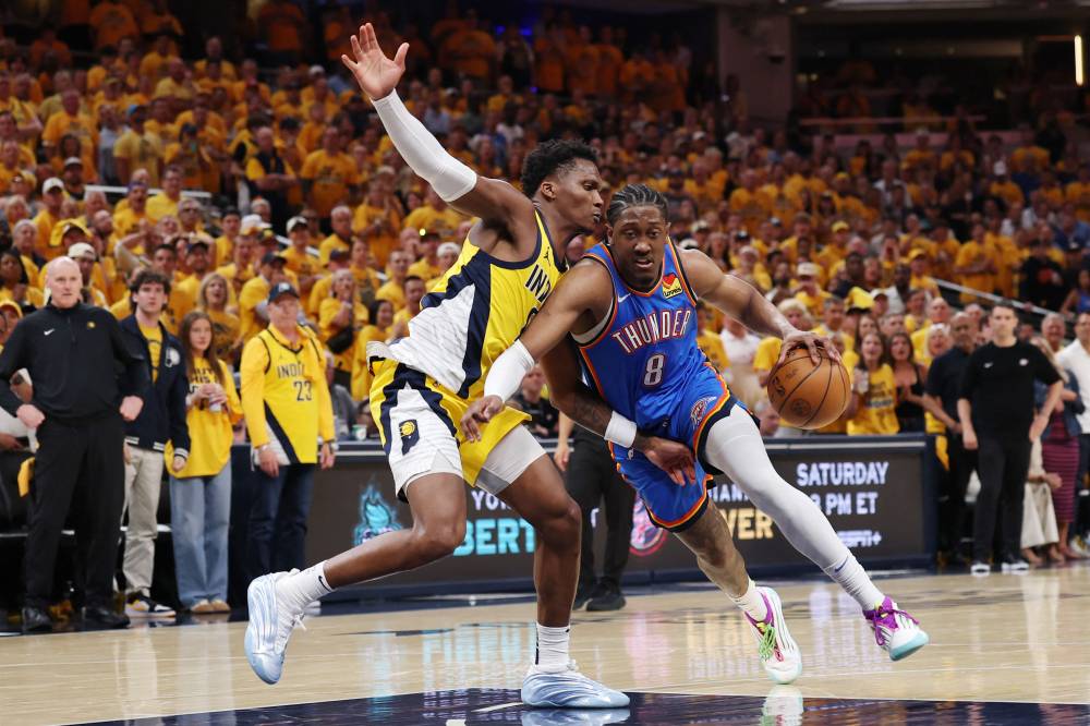 Jalen Williams #8 of the Oklahoma City Thunder drives to the basket against Bennedict Mathurin #00 of the Indiana Pacers during the fourth quarter in Game Three of the 2025 NBA Finals at Gainbridge Fieldhouse on June 11, 2025 in Indianapolis, Indiana. Photo by Dylan Buell/Getty Images via AFP