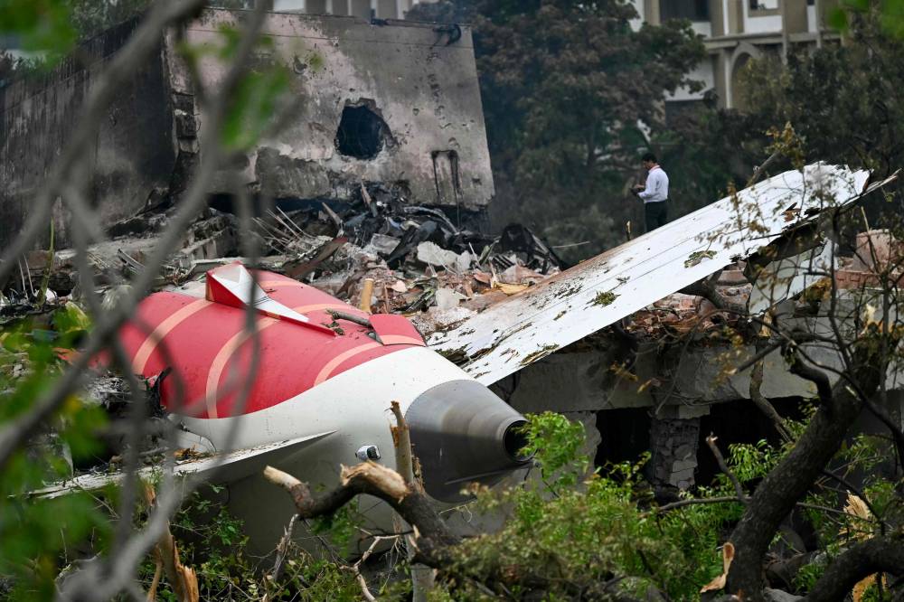 Debris of Air India flight 171 is pictured after it crashed in a residential area near the airport in Ahmedabad on June 13, 2025. - (Photo by PUNIT PARANJPE / AFP)