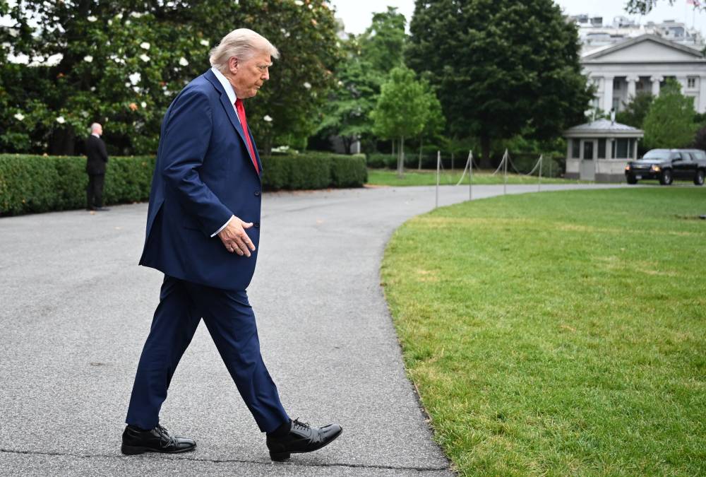 US President Donald Trump makes his way to board Marine One before departing from the South Lawn of the White House in Washington, DC on June 15, 2025. Trump is headed to Canada to attend the G7 summit. (Photo by Mandel NGAN / AFP)