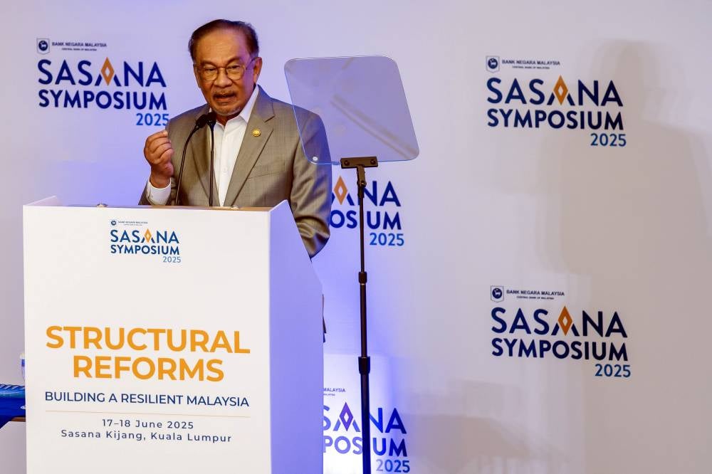Prime Minister Datuk Seri Anwar Ibrahim delivers his keynote address at the Sasana Symposium 2025, today. - Photo by Bernama