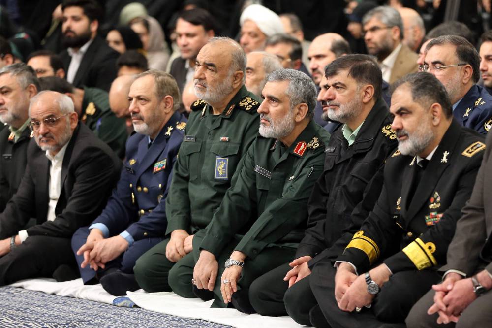 This handout file picture obtained from the the office of Iran's Supreme Leader shows the commander-in-chief of Iran's Islamic Revolutionary Guard Corps Hossein Salami (4th-R) and the commander of the IRGC's Aerospace Forces Amir Ali Hajizadeh (3rd-R) attending a meeting with the supreme leader and officials in Tehran on January 28, 2025. Israel's attack on Iran on June 13, 2025 killed the country's powerful Revolutionary Guards chief Hossein Salami, local media reported and later the Israeli military said that Iranian air force commander Amir Ali Hajizadeh, the drone force commander, and the aerial command chief were all killed by an Israeli air strike as well. (Photo by KHAMENEI.IR / AFP)