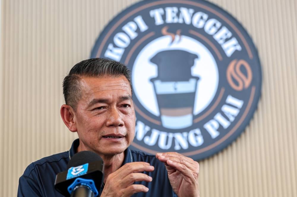 Kopi Tenggek Tanjung Piai business owner, Ghazaley Ayiub, 58, said he was inspired to run the coffee business following a visit to Saigon, Vietnam, where he observed motorcycle vendors selling coffee using a similar method. Photo by Bernama.