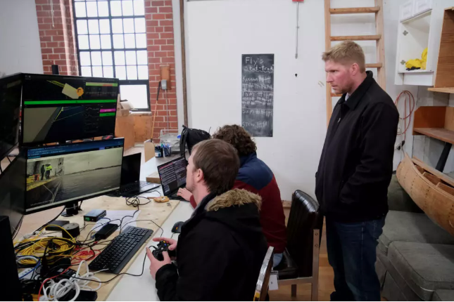 Jason Gillham, Co-Founder of Impossible Metals, inspecting the underwater launch the company's robot. Photo: John Wong / AFP
