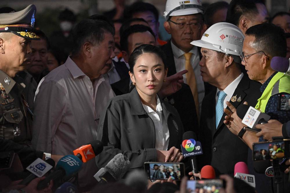 Thai Prime Minister Paetongtarn Shinawatra faced mounting calls to resign on June 19, 2025 after a leaked phone call she had with former Cambodian leader Hun Sen provoked widespread anger and a key coalition partner to quit. (Photo by Lillian SUWANRUMPHA / AFP)