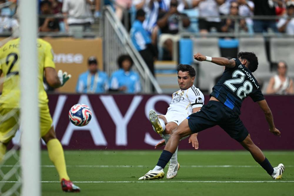 Real Madrid's Moroccan forward #21 Brahim Diaz (C) shoots but fails to score during the FIFA Club World Cup 2025 Group H football match between Spain's Real Madrid and Mexico's Pachuca at the Bank of America stadium in Charlotte on June 22, 2025. (Photo by Paul ELLIS / AFP)