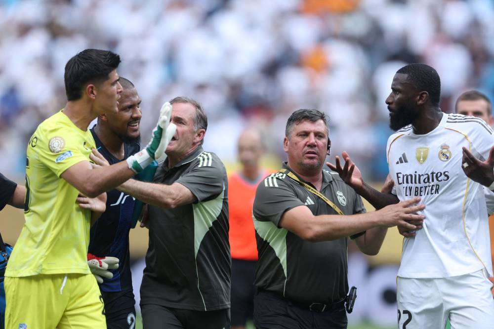 Staff members separate Carlos Moreno #25 of CF Pachuca from Antonio Ruediger #22 of Real Madrid during an altercation in the FIFA Club World Cup 2025 group H match between Real Madrid CF and CF Pachuca at Bank of America Stadium on June 22, 2025 in Charlotte, North Carolina. (Photo by Richard Pelham / GETTY IMAGES NORTH AMERICA / Getty Images via AFP)