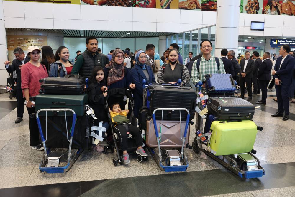 A group of 24 individuals, including 17 Malaysians, safely touched down at KLIA Terminal 1 after being evacuated from Iran amidst escalating conflict. - Bernama photo