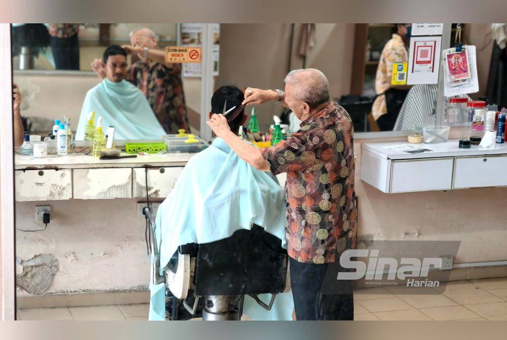 Even at 81, Ng Kim Soy still skillfully cuts hair for his customers, fulfilling special requests at his 