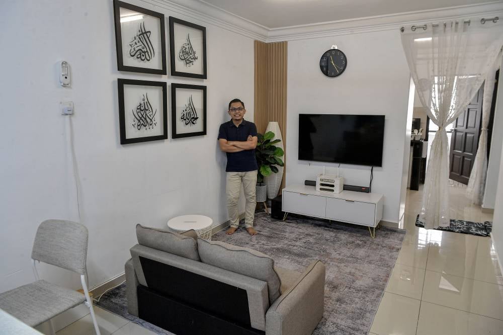 Through clever space utilisation and decor in soft tones, Muhammad Izzat, a photographer at Koperasi Permodalan Felda and his wife Nur Amirah Shari, 35, have transformed the modest unit into a neat as well as visually striking minimalist home. - Bernama photo