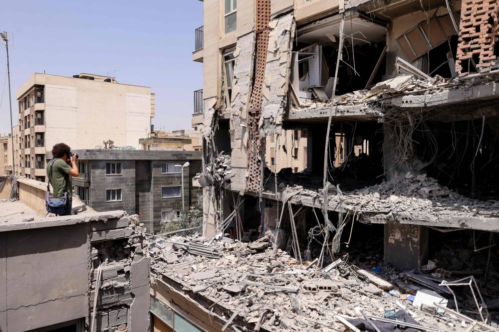 A residential building in Tehran that was hit in an Israeli strike on June 25, 2025. Photo by Atta Kenare/AFP