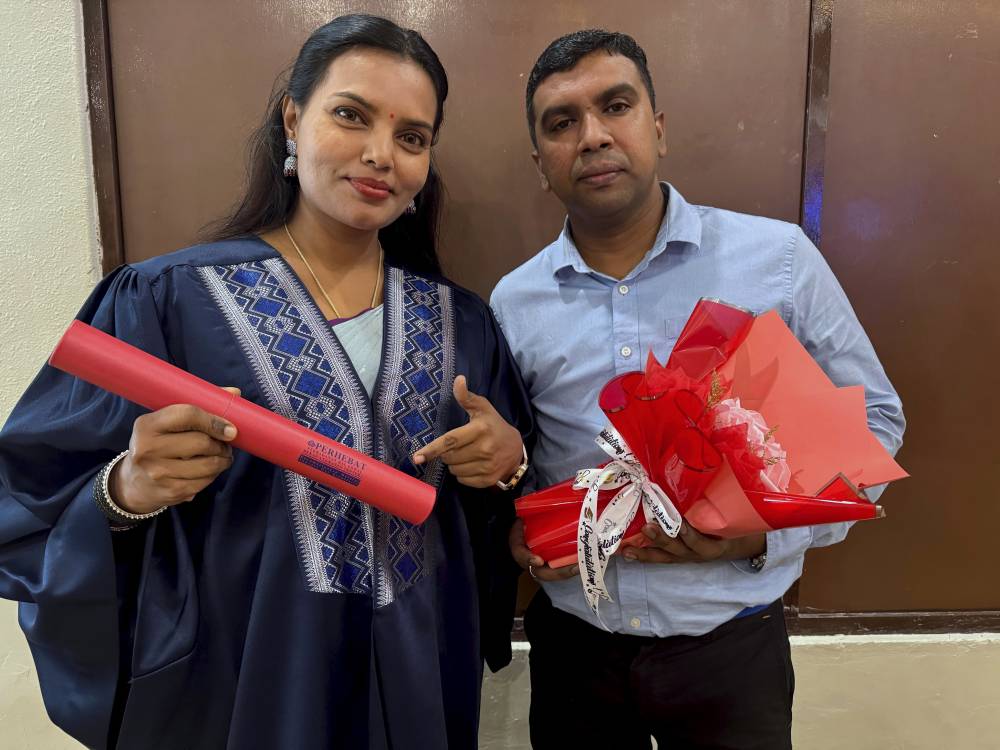 Senior warrant officer P. Maygala, who served in the navy for 21 years, after receiving her certificate from Perhebat on June 11. - Bernama photo