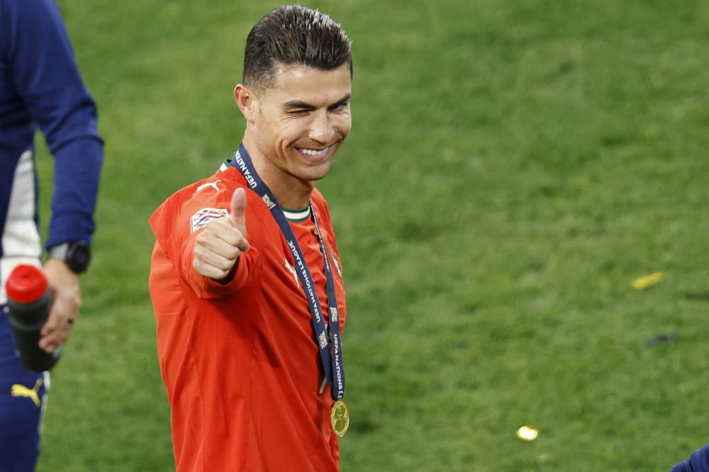 Portugal's forward #07 Cristiano Ronaldo reacts wearing his medal after winning the UEFA Nations League final football match between Portugal and Spain in Munich, southern Germany on June 8, 2025. - (Photo by ALEXANDRA BEIER / AFP)