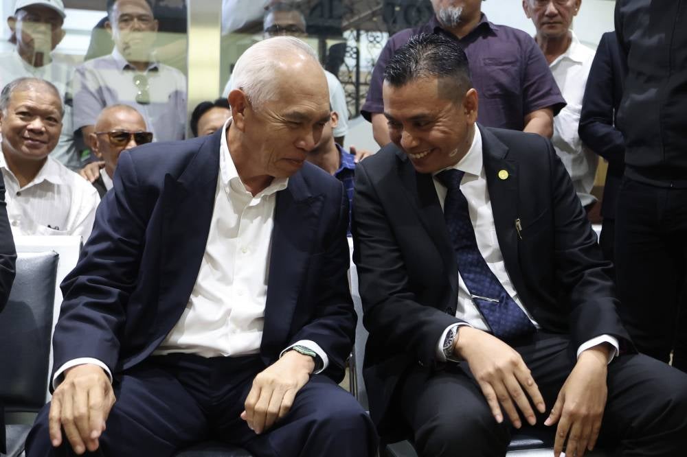 Sindumin assemblyman Datuk Dr Yusof @ Josree Yacob (left) and Tanjung Batu assemblyman Datuk Andi Muhammad Suryady Bandy at the Kota Kinabalu Courts Complex, today. - Photo by Bernama