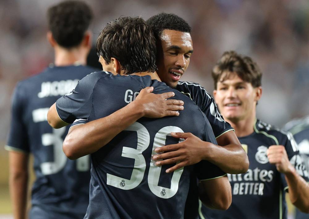 Gonzalo Garcia of Real Madrid C.F. celebrates with Trent Alexander-Arnold #12 of Real Madrid C. F. after scoring his team's goal during the FIFA Club World Cup 2025 group H match (Photo by Francois Nel / GETTY IMAGES NORTH AMERICA / Getty Images via AFP)