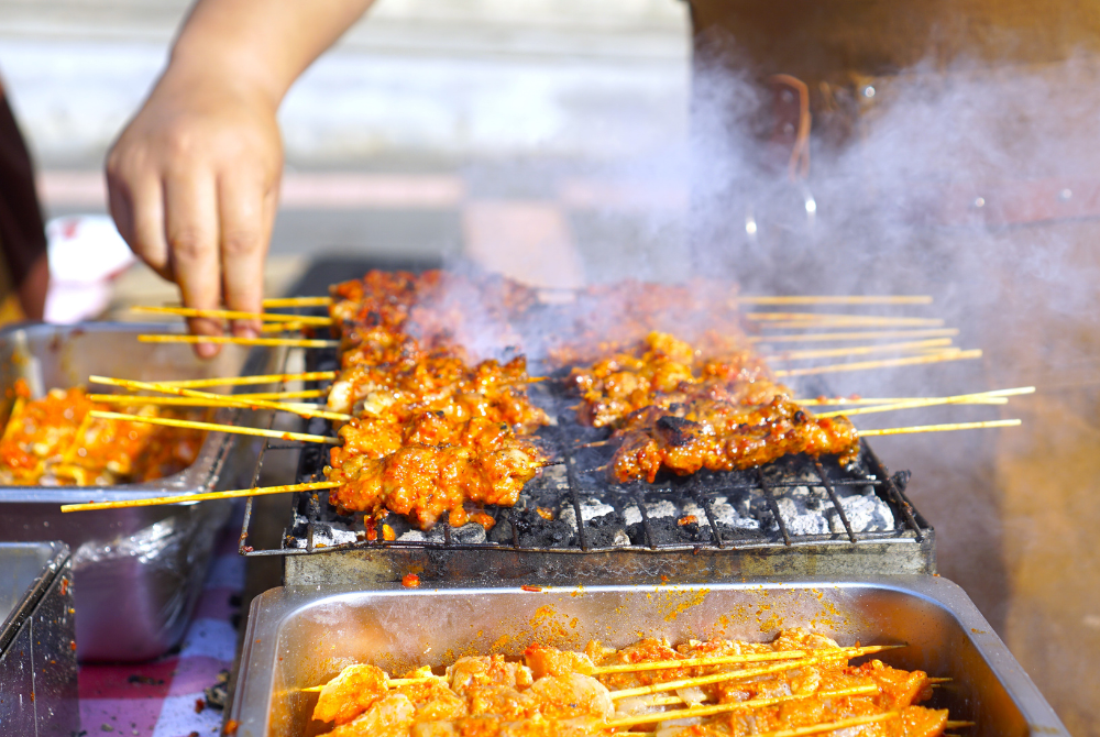In Melaka, satay isn’t just food—it’s an experience, with smoky, char-grilled skewers paired perfectly with a rich, nutty peanut sauce that keeps you coming back for more.
Photo illustrated by Sinar Daily