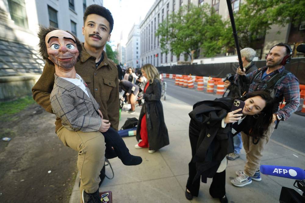 People wait in line outside federal court to attend the sex trafficking trial of Sean "Diddy" Combs in New York City on May 12, 2025. (Photo by TIMOTHY A. CLARY/AFP)
