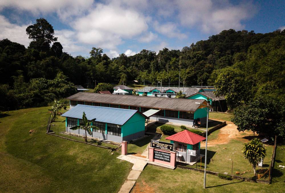 Far from the hustle and bustle of the city, hidden behind the wilderness of the forest and the clear waters of Tasik Banding, SK Sungai Tiang becomes a beacon of hope for the children of the Orang Asli Jahai tribe in the hinterlands of Royal Belum. Photo by Bernama