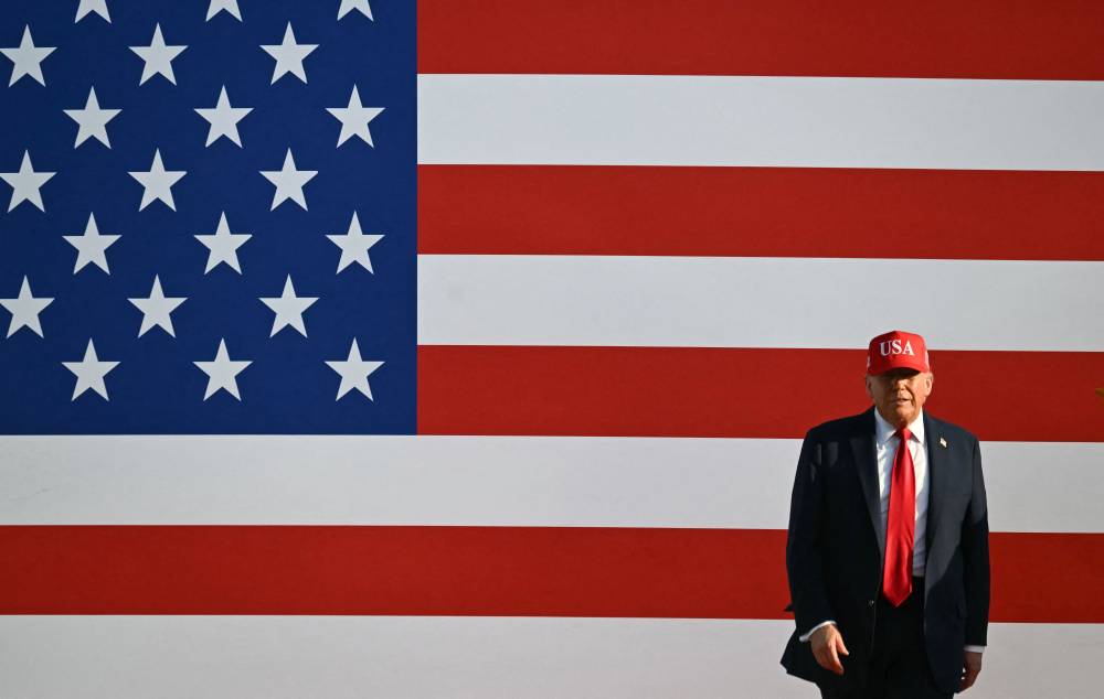 US President Donald Trump steps on stage to deliver remarks at the Salute to America Celebration at the Iowa State Fairgrounds in Des Moines on July 3, 2025. - (Photo by ANDREW CABALLERO-REYNOLDS / AFP)