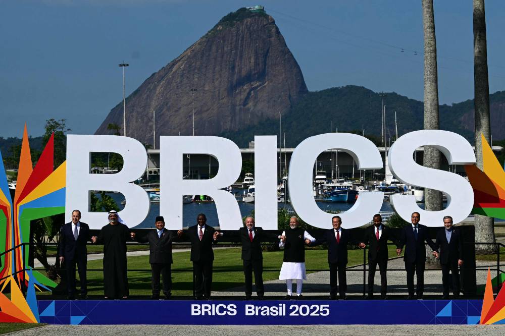 BRICS leaders pose for a family photo during the BRICS summit in Rio de Janeiro, Brazil, on July 6, 2025. - Photo by PABLO PORCIUNCULA / AFP)