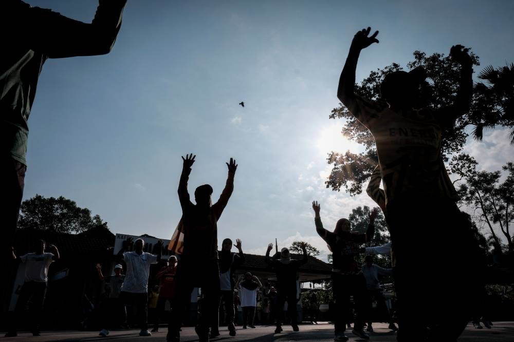 Participants taking part in the aerobics workout session led by instructor Syed Abdul Rahman Syed Jaafar at Taman Merdeka. - Bernama photo