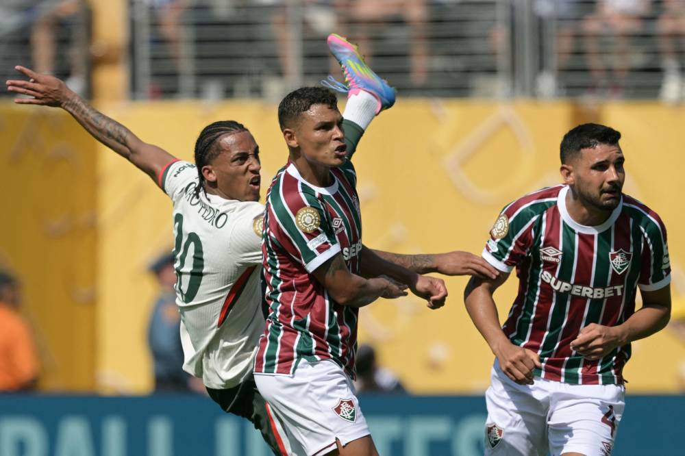 Chelsea's Brazilian forward #20 Joao Pedro (L) scores his team's second goal during the FIFA Club World Cup 2025 semifinal football match between Brazil's Fluminense and England's Chelsea at the MetLife stadium in East Rutherford, New Jersey on July 8, 2025. (Photo by JUAN MABROMATA / AFP)