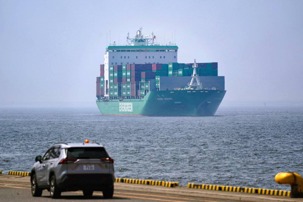A cargo ship arrives at the international cargo terminal at the port of Tokyo on July 8, 2025. (Photo by Kazuhiro NOGI / AFP)