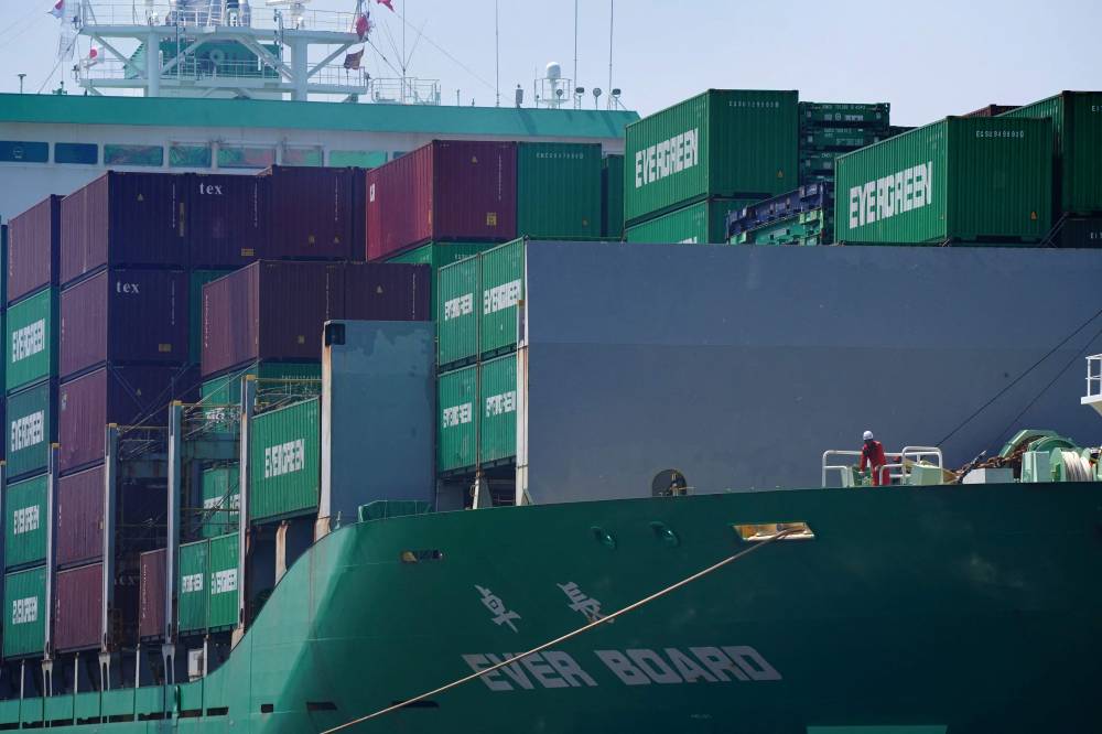 A cargo ship docks at the quay of the international cargo terminal at the port of Tokyo on July 8, 2025. (Photo by Kazuhiro NOGI / AFP)