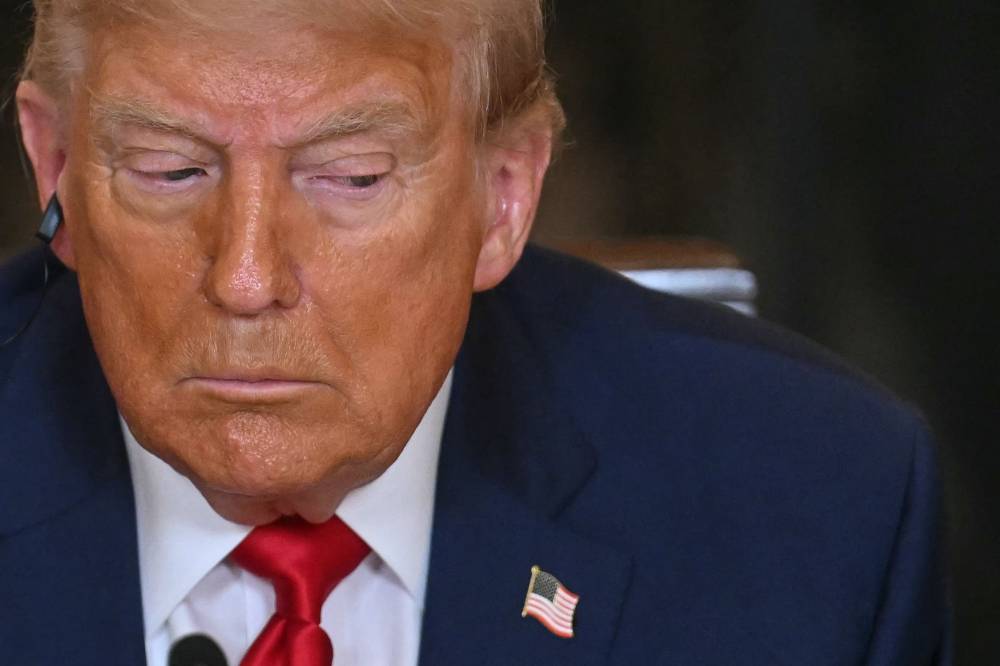 US President Donald Trump speaks during a multilateral lunch with visiting Afrian Leaders in the State Dining Room of the White House in Washington, DC, on July 9, 2025. - (Photo by Jim WATSON / AFP)