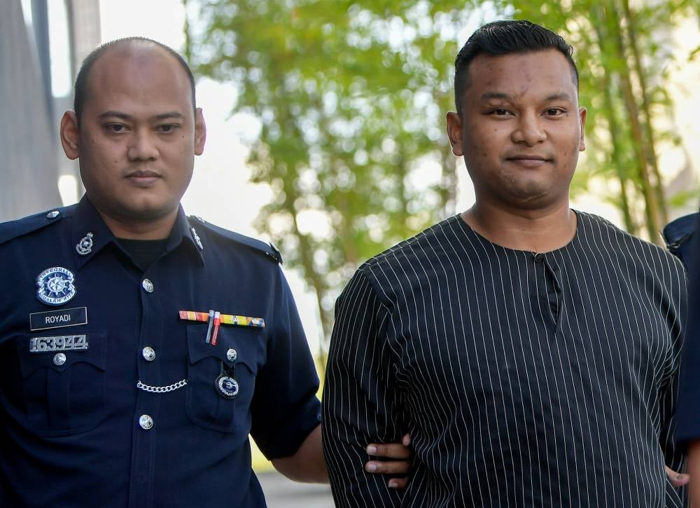 Social media influencer, known as ‘CEO Batu’, was once again brought before the court today, on a charge of possessing pornographic videos and images on his mobile phones two months ago. Photo by Bernama 