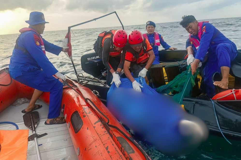 This handout photo taken and released on July 8, 2025 by Indonesia's National Search and Rescue Agency (BASARNAS) shows Indonesian SAR personnel evacuating the bodies of two suspected victims of the KMP Tunu Pratama Jaya vessel that sank on July 4, found in the waters off the Tanjung Anjir Sembulungan strait in Banyuwangi, East Java. - AFP 