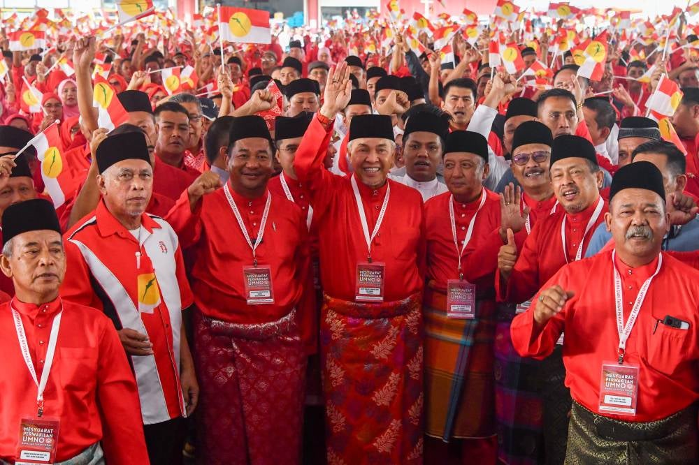 Umno President, Datuk Seri Dr Ahmad Zahid Hamidi (centre) with delegates during the opening ceremony of the 2025 Umno Tanah Merah Division Delegates Meeting. Photo by Bernama 
