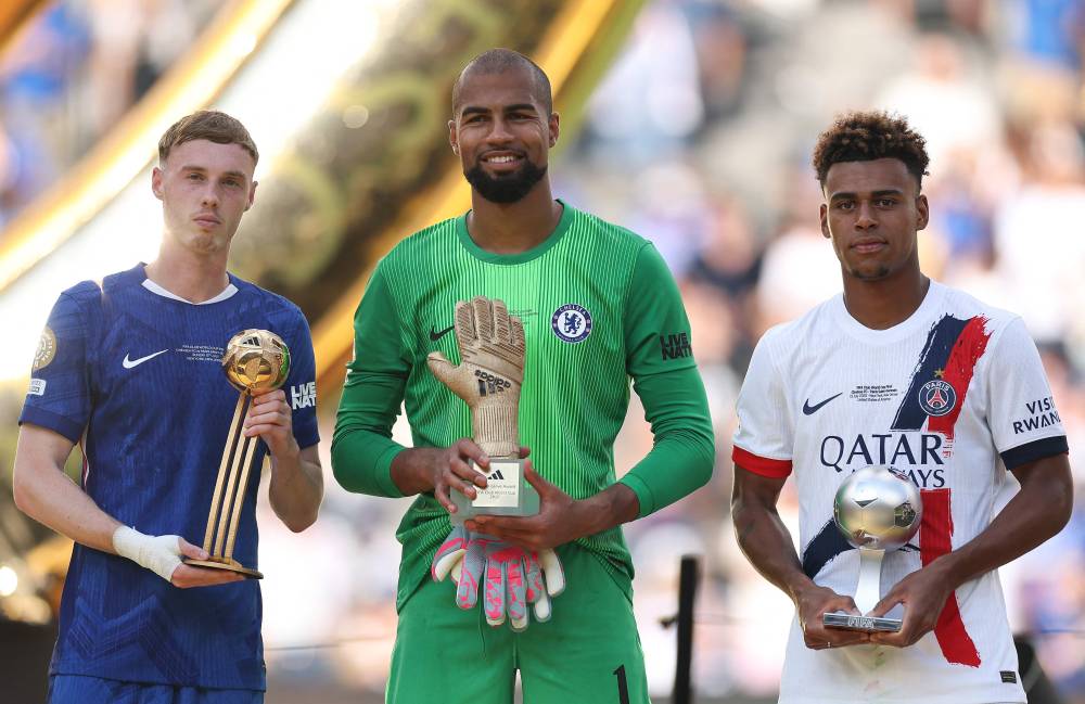 (L-R) Cole Palmer #10 of Chelsea FC holding the adidas Golden Ball, Robert Sanchez #1 of Chelsea FC holding the adidas Golden Glove and Desire Doue #14 of Paris Saint-Germain holding the FIFA Best Young Player Award presented by Panini pose for a photo during the FIFA Club World Cup 2025 Final match between Chelsea FC and Paris Saint-Germain at MetLife Stadium on July 13, 2025 in East Rutherford, New Jersey. Buda Mendes/Getty Images/AFP (Photo by Buda Mendes / GETTY IMAGES NORTH AMERICA / Getty Images via AFP)