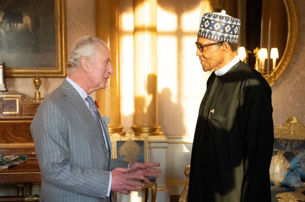 Britain's King Charles III (L) receives President of Nigeria Muhammadu Buhari during an audience at Buckingham Palace, in London on November 9, 2022. Former Nigerian president Muhammadu Buhari -- who led his country first as a military strongman and later as an elected democrat -- died Sunday at the age of 82, an aide said. (Photo by Stefan Rousseau / WPA Rota / AFP)