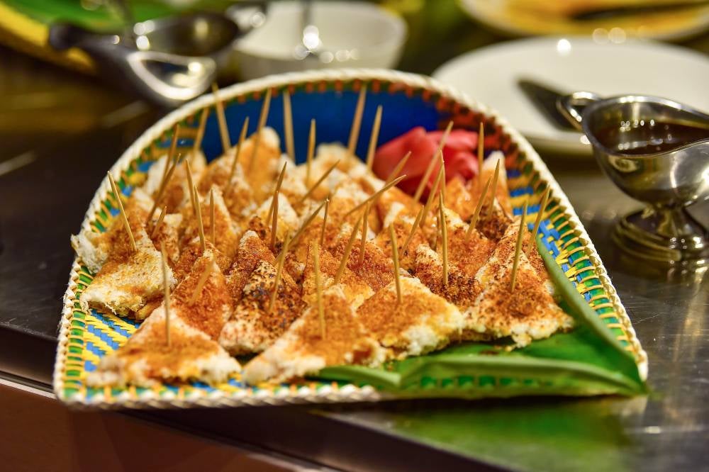 Tumpik, a traditional Sarawak delicacy, once served as a staple during the British colonial era. More than just a snack, it can be enjoyed with various fillings such as shrimp, fish, and gula apong (palm sugar), as showcased during the launch of Serumpun Sarawak. Photo by Bernama