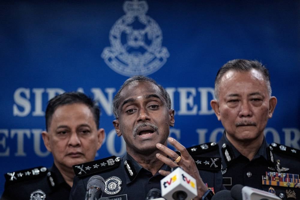 M Kumar (centre) during a press conference at the Johor Police Contingent Headquarters on Monday. Photo by Bernama