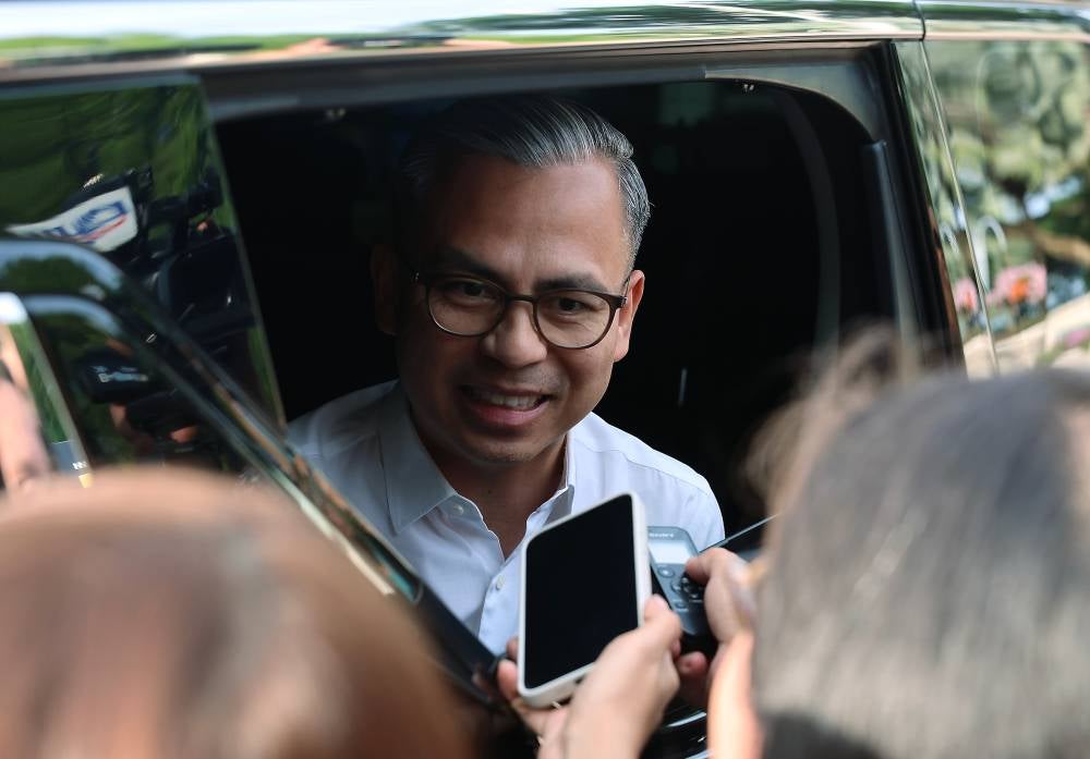 Communications Minister Datuk Fahmi Fadzil who is also PKR information chief after the meeting at Seri Perdana Complex, today. - Photo by Bernama