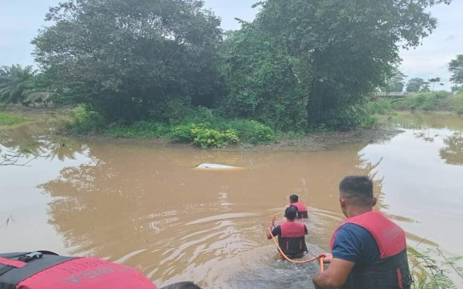 A Perodua Axia had plunged into a river about two metres deep. Photo courtesy of Fire and Rescue Department