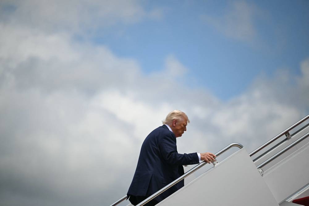 US President Donald Trump boards Air Force One at Joint Base Andrews, Maryland on July 15, 2025. - (Photo by ANDREW CABALLERO-REYNOLDS / AFP)