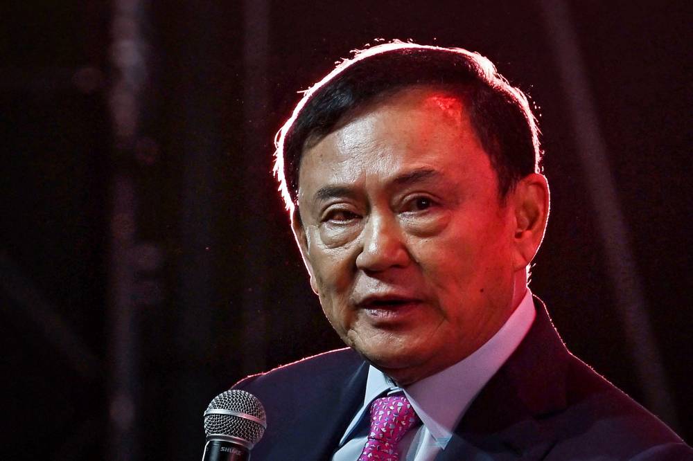 Thailand's former Prime Minister Thaksin Shinawatra speaks at the SPLASH - Soft Power Forum 2025 at Queen Sirikit National Convention Centre in Bangkok on July 9, 2025. - (Photo by LILLIAN SUWANRUMPHA / AFP)