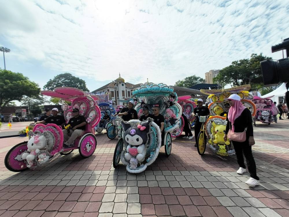 In a move that blends nostalgia with innovation, tourists can now book these colourful, pedal-powered rides with just a few taps on their phones. Photo by Bernama