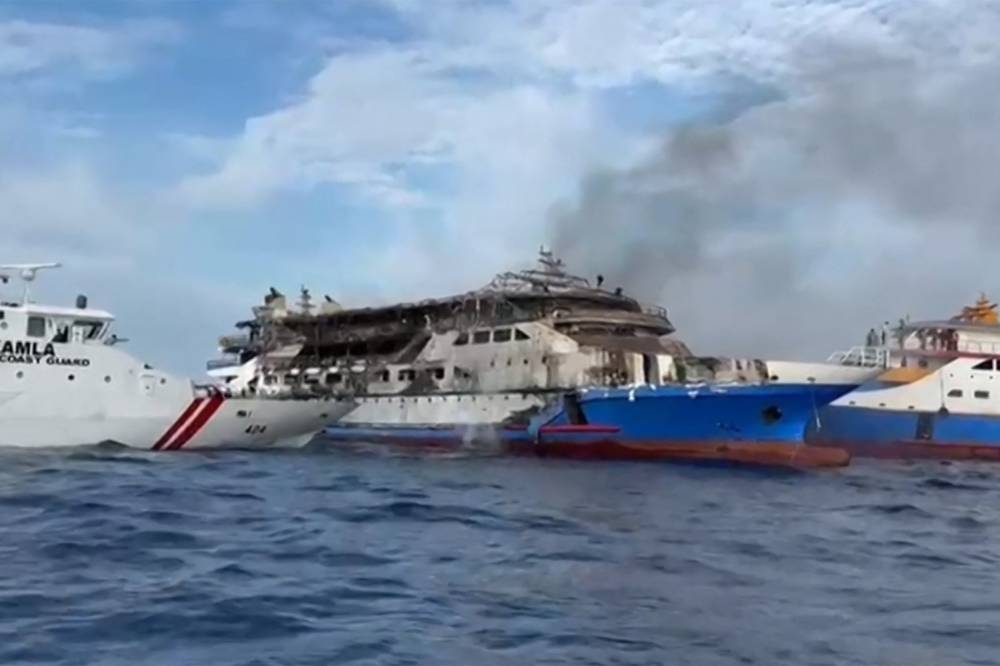 This screen grab taken from video released by Indonesia's National Search and Rescue Agency (Basarnas) and the Indonesian Coast Guard shows the KM Barcelona 5 ferry after a fire broke out while on its way to Manado, the capital of North Sulawesi province. Photo by AFP