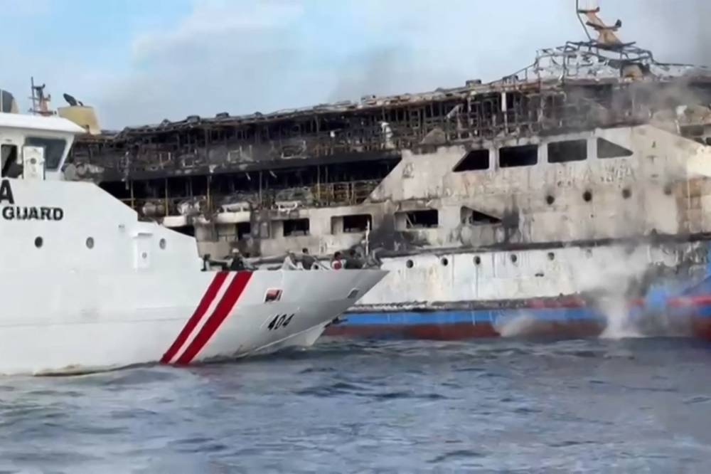 This screen grab taken from video released by Indonesia's National Search and Rescue Agency (Basarnas) and the Indonesian Coast Guard shows the KM Barcelona 5 ferry after a fire broke out while on its way to Manado, the capital of North Sulawesi province. Photo by AFP