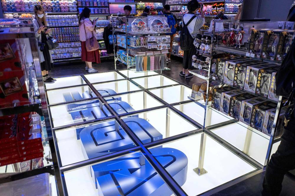 The logo of Japanese video game and entertainment company Sega is displayed at the company's first official store in Tokyo's Shibuya district on July 16, 2025. (Photo by Kazuhiro NOGI / AFP)