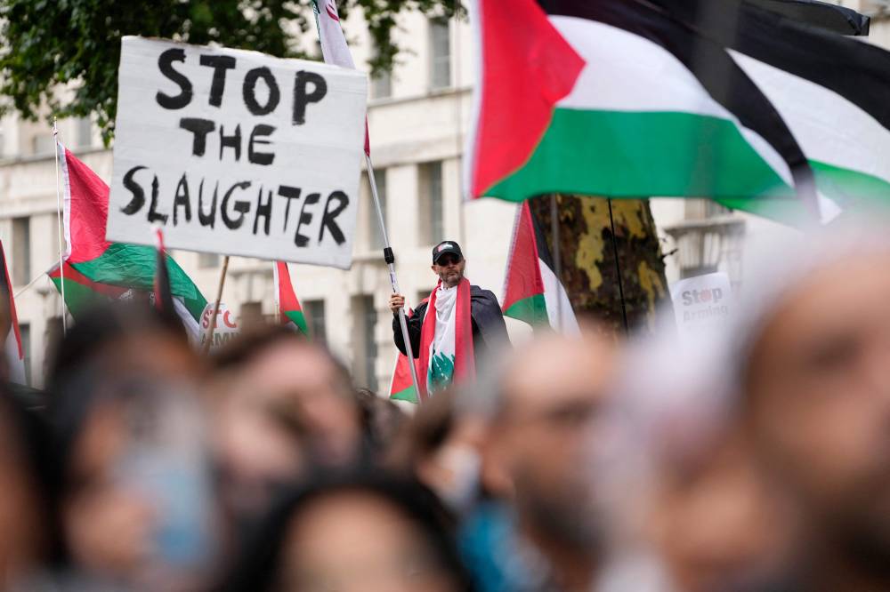 Pro-Palestinian supporters hold placards and wave flags on Downing Street in central London, on July 19, 2025, as they take part in a 'National March for Palestine' organised by the Palestine Solidarity Campaign. AFP photo