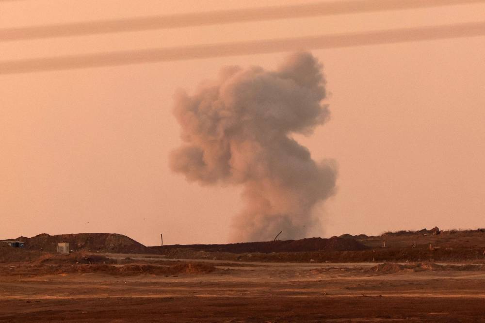 This picture taken from a position on the Israeli border with the Gaza Strip, shows smoke billowing during Israeli strikes in the Palestinian territory, on July 21, 2025. Photo by AFP