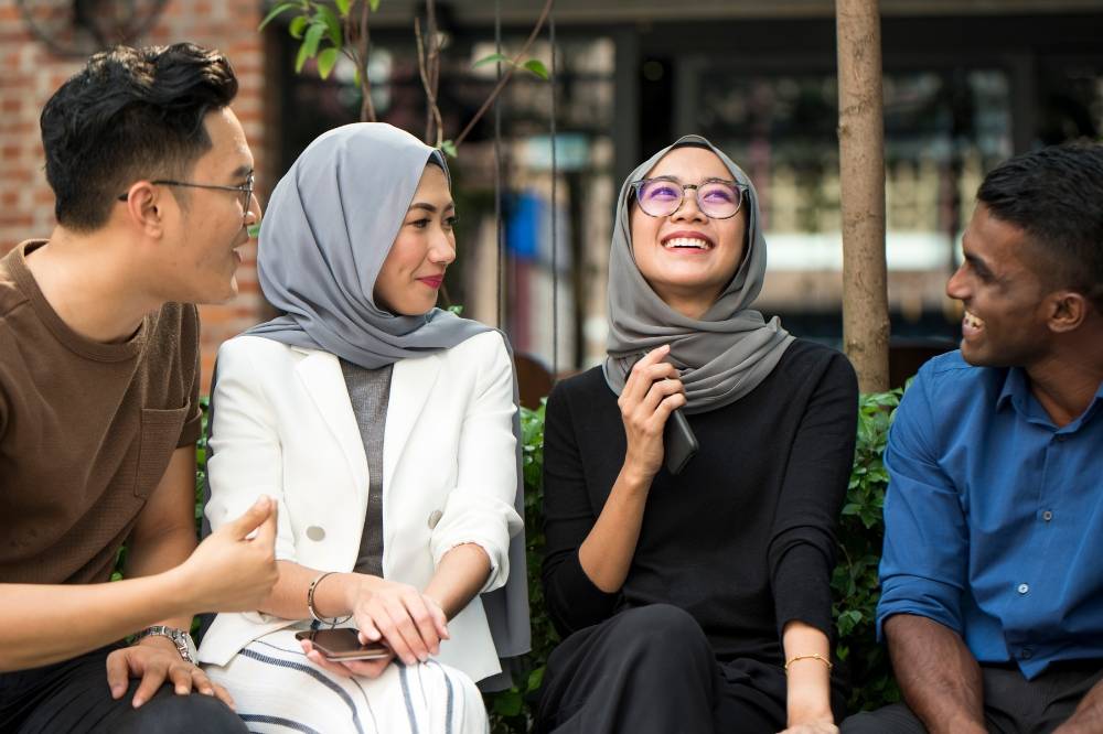 In Malaysia, life changes like marriage, parenthood and career shifts shape friendships differently for men, women and generations, yet the cultural bond through food, faith and community stays strong. Photo: Edited via Canva