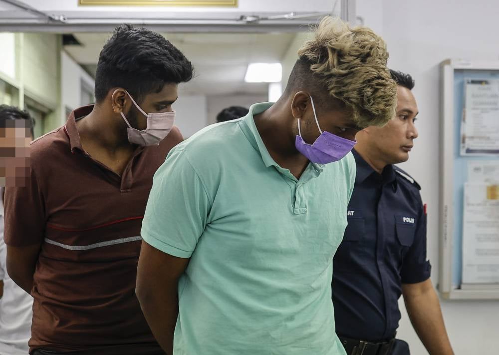 Two siblings pleaded not guilty in the Magistrate's Court today to charges of kidnapping and voluntarily causing hurt to a man last week. - Photo by Bernama