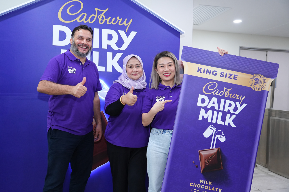 From left: Mondelēz International (Malaysia) Manufacturing director Abdallah Habib, Corporate and Government Affairs, head, Raja Zalina Raja Safran and Mondelēz International (Malaysia & Singapore) marketing head, See Mei Sin unveiling the Cadbury King Size 200g bar that features a richer, creamier, and more indulgent recipe for its classic Cadbury Dairy Milk. - Photo by Cadbury's management
